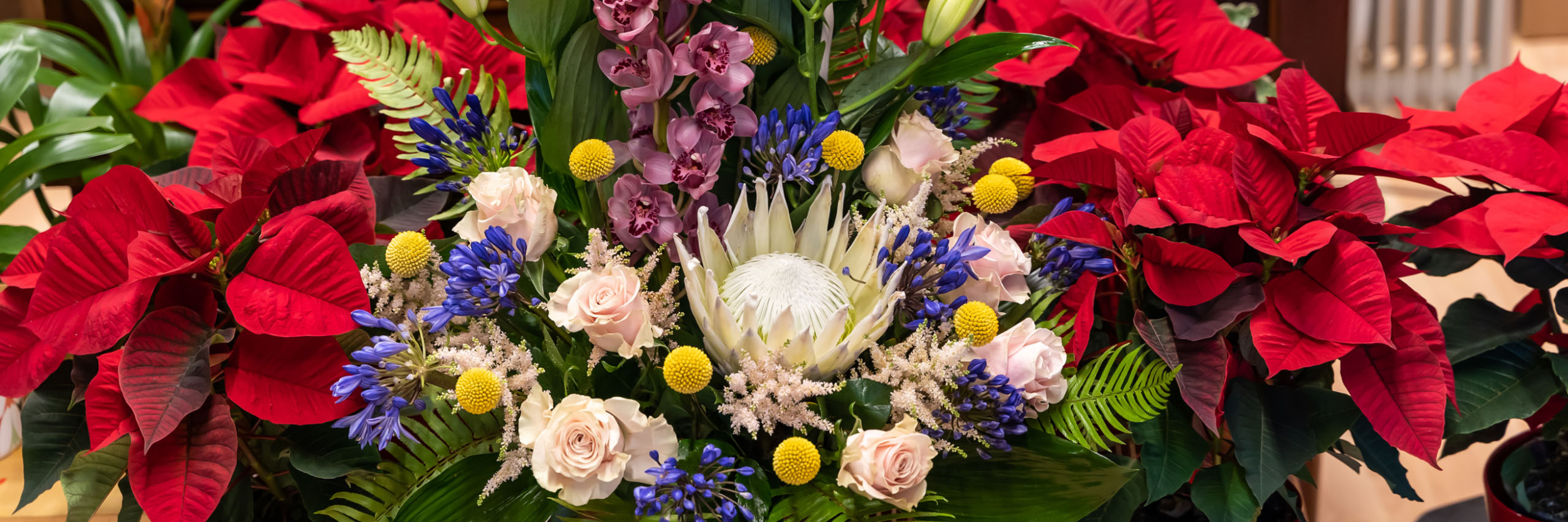 What do Embalmers Do? A Look Inside this Unique Career in the Funeral Industry header image of flower arrangement
